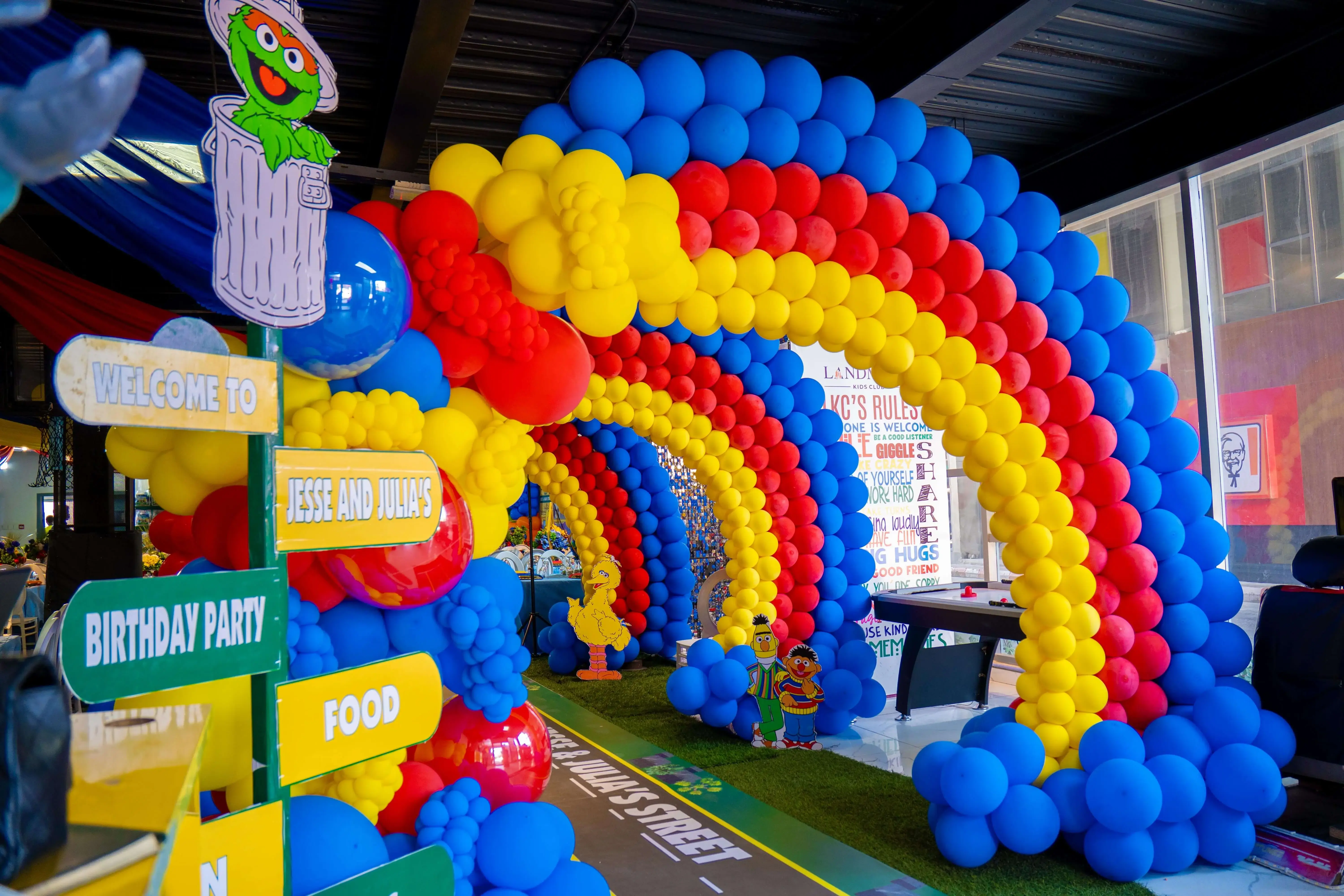 Child playing in a colorful ball pit